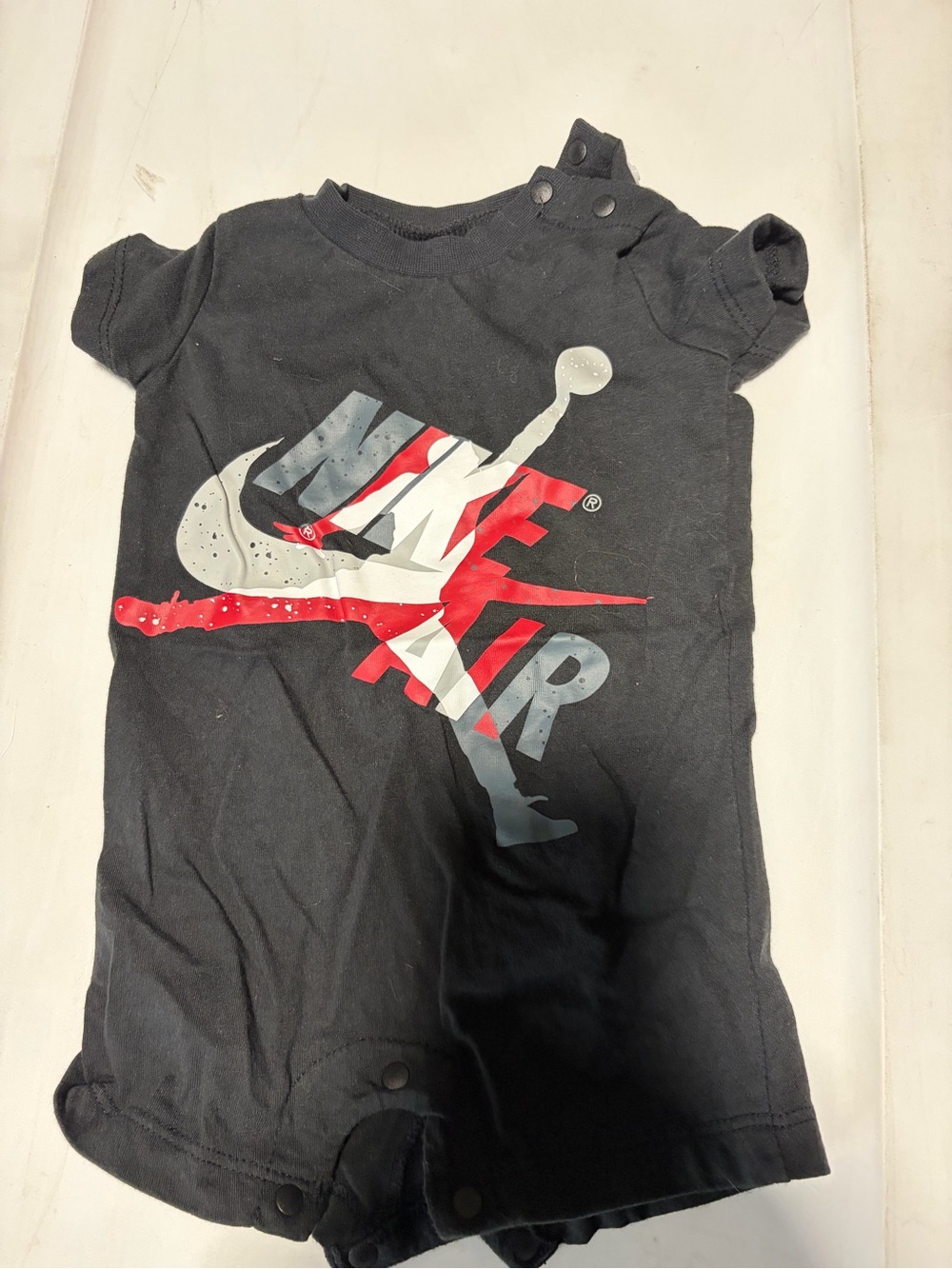 Jordan Baby Black Short Sleeve Romper with Red & Gray 'Jumpman' Graphic